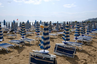 Aerial view of hooded chairs on beach