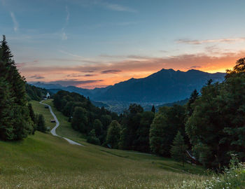 Scenic view of landscape against sky during sunset