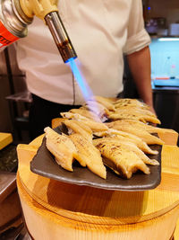 Close-up of man preparing food