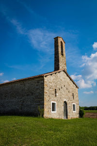 Low angle view of old building against sky