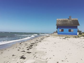 Scenic view of beach against clear sky