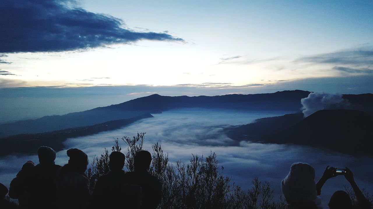 sky, cloud - sky, silhouette, mountain, nature, real people, beauty in nature, outdoors, travel destinations, scenics, sunset, mountain range, day, tree, architecture