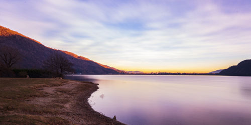 Scenic view of lake against sky during sunset