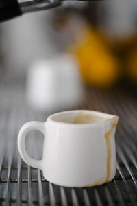 Close-up of coffee cup on table