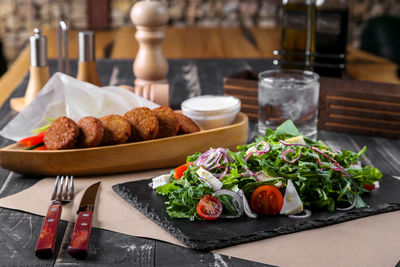 Close-up of food served on table