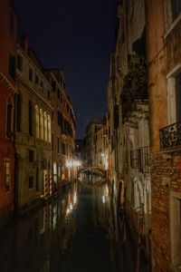 Reflection of illuminated buildings in water at night