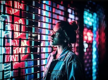 Portrait of young woman using mobile phone