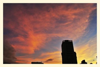 Low angle view of cloudy sky at sunset