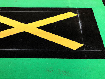 High angle view of arrow sign on road