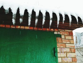 Built structure on frozen wall of building