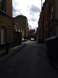 City street against cloudy sky