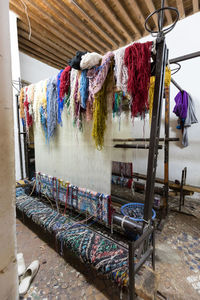 Clothes drying on table against wall