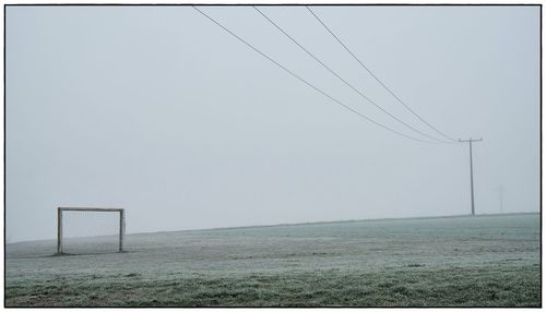 Scenic view of field against clear sky