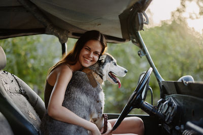 Portrait of young woman with dog