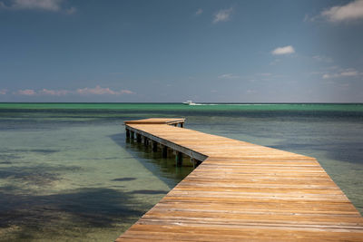 Pier over sea against sky