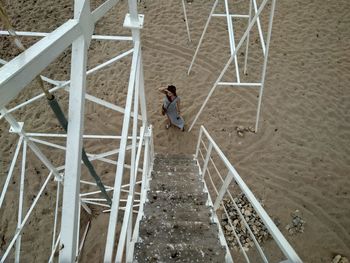 High angle view of man standing on staircase at construction site