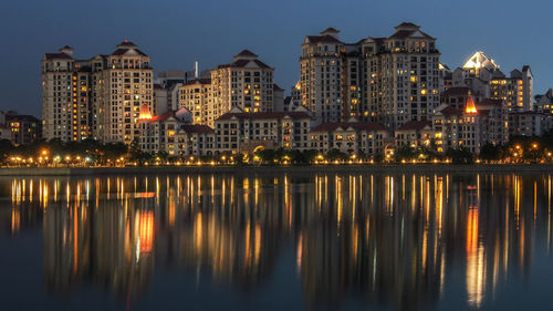 Reflection of buildings in city at night