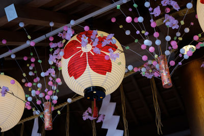 Low angle view of lanterns hanging at night