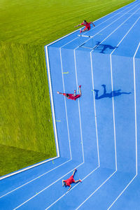 High angle view of people playing on grassland