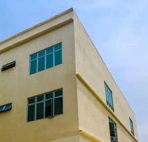 Low angle view of building against clear blue sky