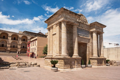 View of historical building against cloudy sky