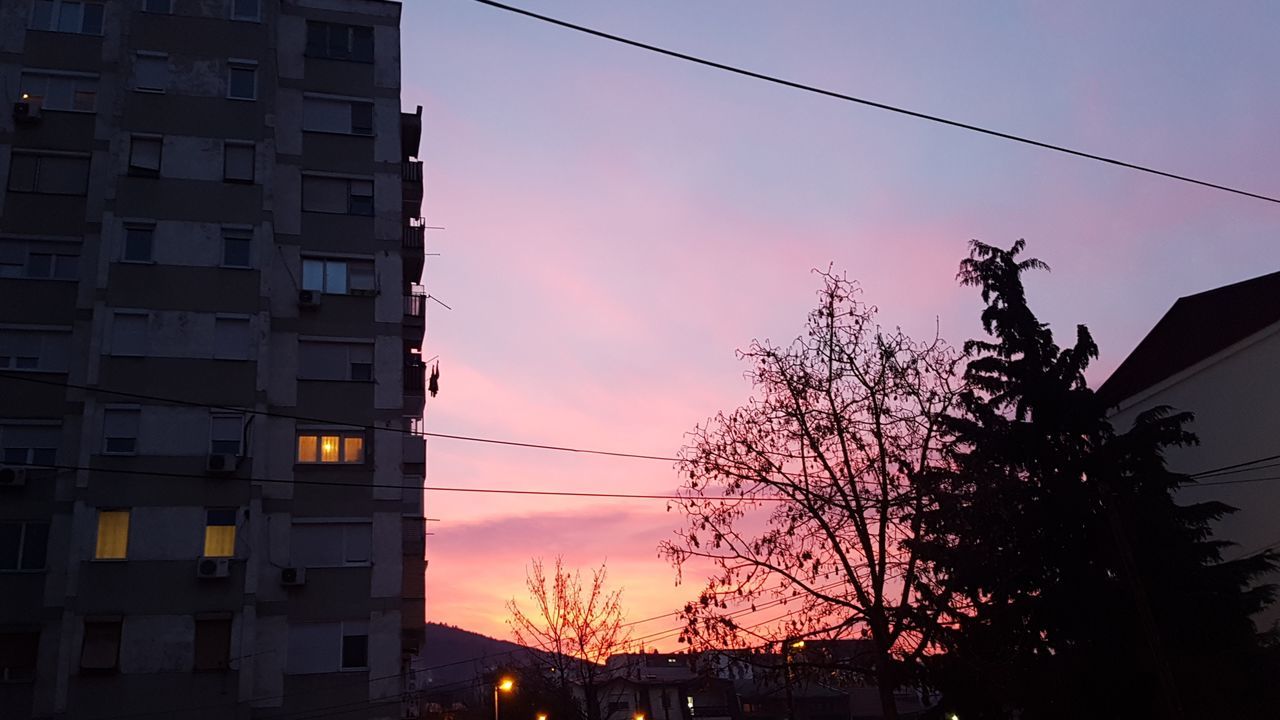 sunset, building exterior, architecture, built structure, silhouette, sky, tree, dusk, cable, no people, outdoors, city, low angle view, nature, electricity pylon, beauty in nature, day