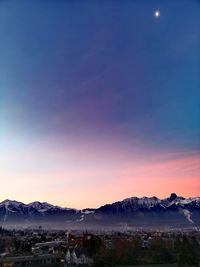 Scenic view of mountains against sky at sunset