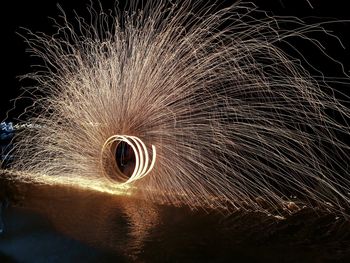 Wire wool over water at night