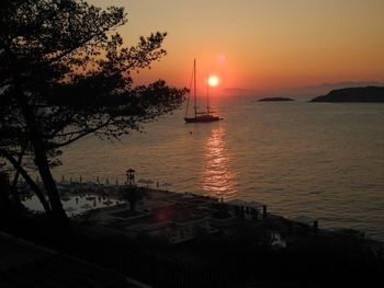 Scenic view of sea against orange sky