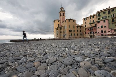 Pebbles against sky at beach