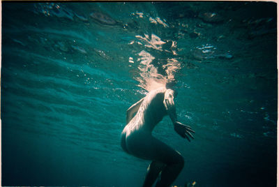 Man swimming in sea