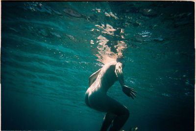 Man swimming in sea