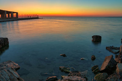 Scenic view of sea against sky at sunset