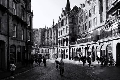 People walking on street in city