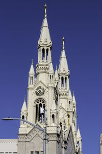 Low angle view of building against blue sky