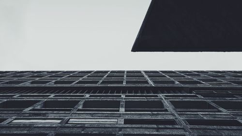 Low angle view of blue sky with reflection of building