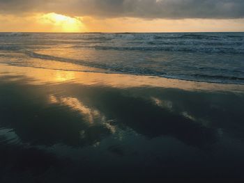 Scenic view of sea against sky at sunset