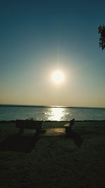 Scenic view of sea against clear sky during sunset