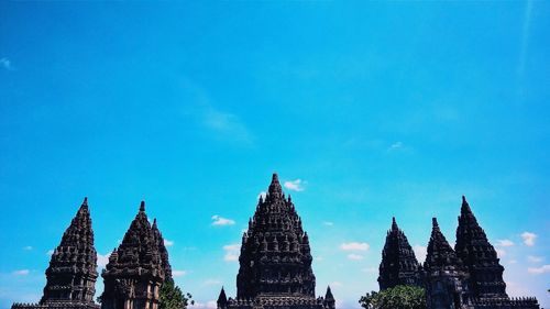 Panoramic view of temple building against blue sky