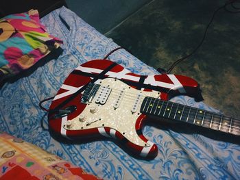 High angle view of guitar at home