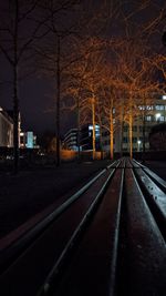 View of illuminated railroad tracks at night