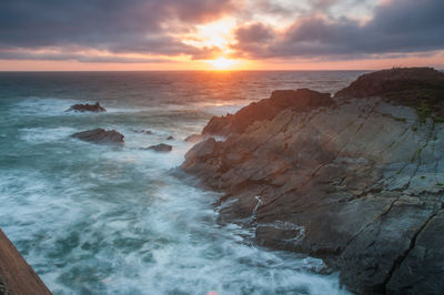 Scenic view of sea against sky during sunset