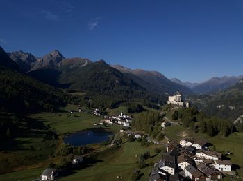 Scenic view of mountains against blue sky