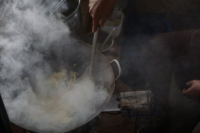 Midsection of man preparing food