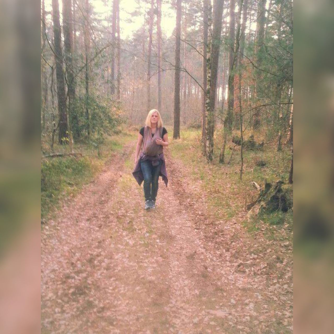 WOMAN WALKING IN A FOREST