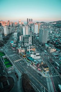 High angle view of city street and buildings against sky