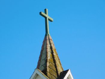 Low angle view of temple against clear blue sky