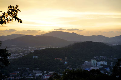 Scenic view of silhouette mountains against sky at sunset