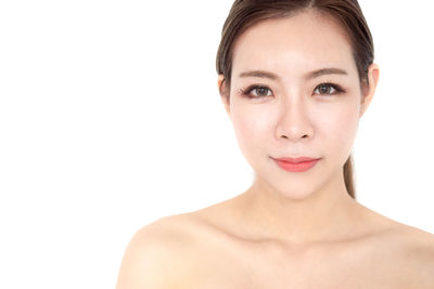 Portrait of a beautiful young woman over white background