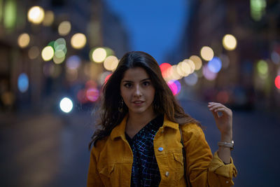 Portrait of young woman on street